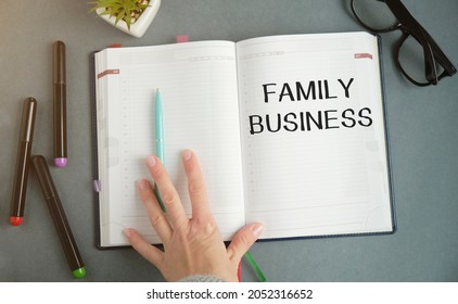 Business And Economics. Among The Documents, Folders, A Notebook With The Inscription - FAMILY BUSINESS