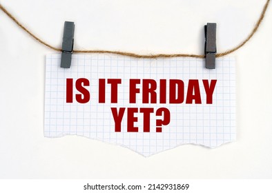 Business and education concept. A sheet of paper with the inscription is attached to the rope with clothespins - IS IT FRIDAY YET