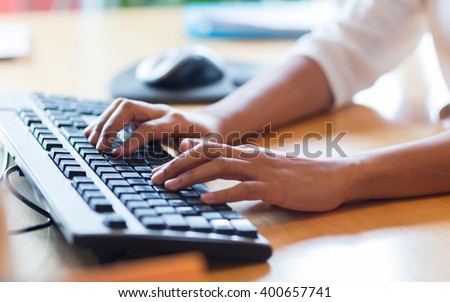 business, education, programming, people and technology concept - close up of african american female hands typing on keyboard