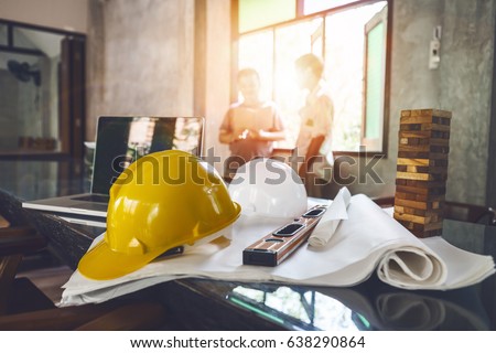 Business engineer contractor who contracts to supplies consulting about working their job at construction site office headquarters.