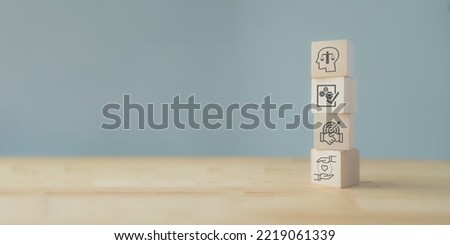 Business ethics concept. Ethics inside human mind. Business integrity and moral. Wooden cubes with ethics inside a head standing with other ethics icon. Company culture and sustainable success concept