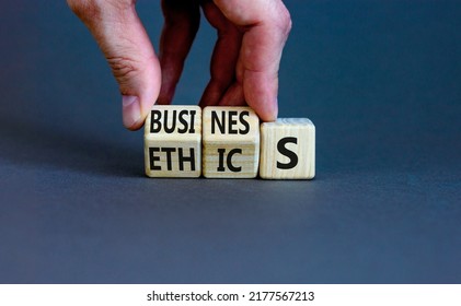 Business ethics symbol. Concept words Business ethics on wooden blocks. Businessman hand change words business on ethics. Beautiful grey table grey background. Business ethics concept. Copy space. - Shutterstock ID 2177567213