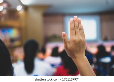 Business event with audience in conference hall while speaker giving talk in meetning hall. Business Woman raising hands for ask tutor traning in lecture public. - Powered by Shutterstock