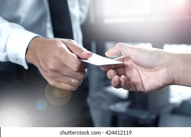 business executive exchanging business card - Powered by Shutterstock