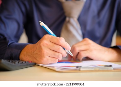 Business Executive Making Paper Notes. Male Financial Advisor Working In An Office At A New Company.