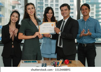 business executive management giving certificate of excellence to executive team members awarding for success recieving from good job performance with other team members participate in celebrating - Powered by Shutterstock