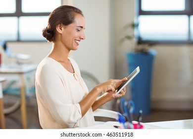 Business executive using digital tablet in office