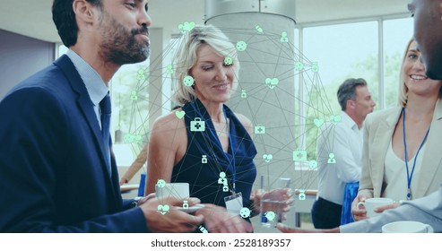 Business executives meeting and networking over coffee at a conference center. - Powered by Shutterstock