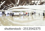 Business exhibition event convention space blurs the background of technology exhibition, trade show, passenger terminal or museum gallery lobby with a blurry interior.