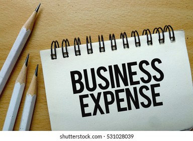 Business Expense Text Written On A Notebook With Pencils