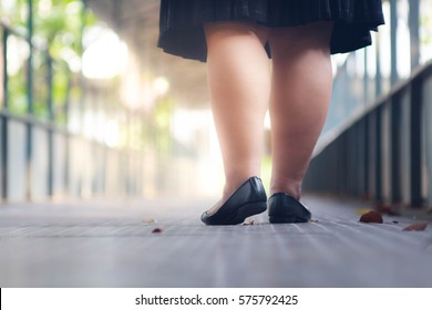 Business Fat Woman Shoes Walking On The Bridge.