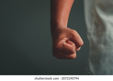 Business fight concept close-up portrait of a young man's fist on a black background
 - Shutterstock ID 2072190794