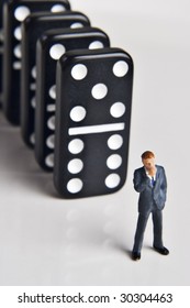 Business Figurine And Dominos