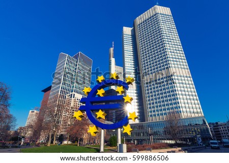 Business and finance concept with giant Euro sign at European Central Bank headquarters in the morning, business district in Frankfurt am Main, Germany.