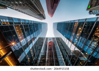 Business and finance concept, looking up at high rise office building architecture in the financial district of a modern metropolis. - Shutterstock ID 2064915158