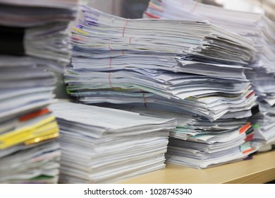 Business and finance concept of office working, Pile of unfinished documents on office desk, Stack of business paper