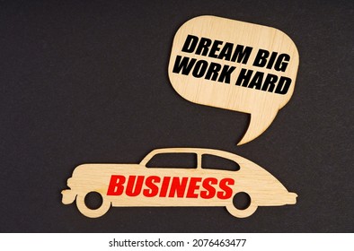 Business And Finance Concept. On A Black Background, A Car With The Inscription Business, Above It A Plate With The Inscription - Dream Big Work Hard