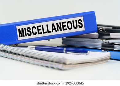 Business and finance concept. On the table are a notebook, a pen, documents and a folder with the inscription - MISCELLANEOUS - Shutterstock ID 1924800845