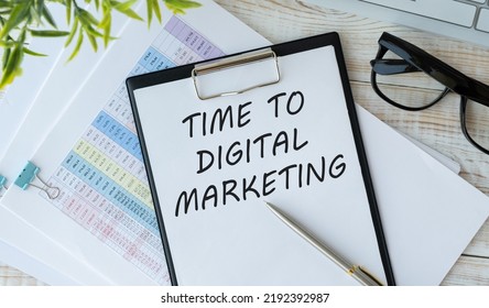 Business and finance concept. On the table are paper clips, note paper with text - Time to digital marketing. - Shutterstock ID 2192392987