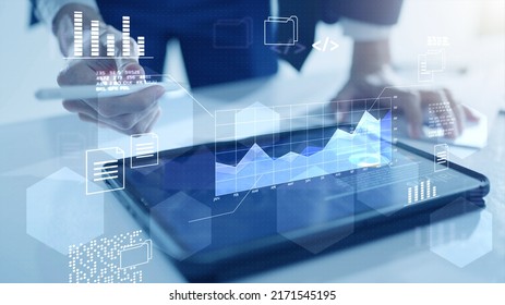 Business finance data analytics graph chart report, man using mobile tablet searching investment data digital GDP marketing KPI sale report, financial management technology, virtual screen metaverse. - Powered by Shutterstock