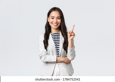 Business, finance and employment, female successful entrepreneurs concept. Successful female businesswoman, asian real estate broker pointing finger, showing number one and smiling - Shutterstock ID 1784752541