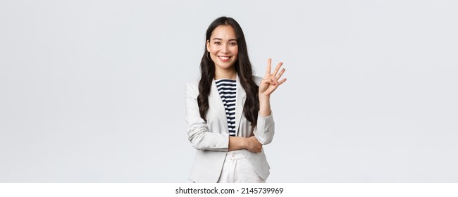 Business, Finance And Employment, Female Successful Entrepreneurs Concept. Successful Female Businesswoman, Asian Real Estate Broker Pointing Finger, Showing Number Four And Smiling