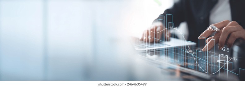 Business, finance and investment concept. Businessman using digital tablet analyzing and calculating financial data with economic graph growth chart, Business strategy and planning. market research - Powered by Shutterstock