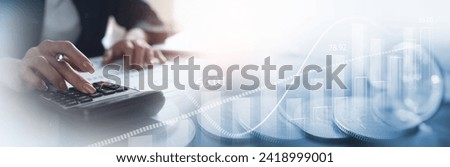 Business, finance and investment, currency exchange concept. Accountant using calculator with coins and financial report, economic graph growth, finance background