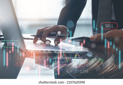 Business, finance and investment, forex trading, currency exchange, economic growth, stock market analysis concept. Double exposure of businessman using laptop and coins with financial graph chart - Shutterstock ID 2107620398