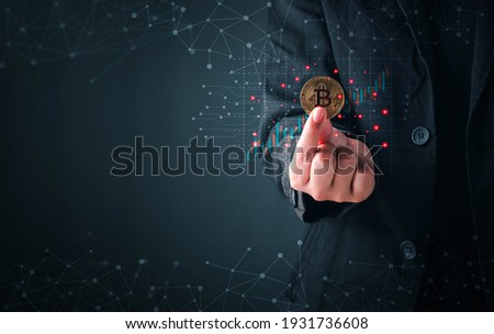 Business and Finance, Savings, Investing with Digital Assets, Future finance, blockchain. Business man holding golden cryptocurrency coins bitcoin on financial growth chart background.