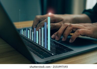 Business finance technology and investment concept, Man typing keyboard on laptop or computer. - Shutterstock ID 2151997193