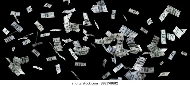 Business, Finance, Waste And Concept - Close Up Of Us Dollar Money Flying Over Black Background