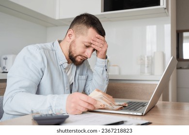 business, finances, accounting and people concept - man with money and calculator filling papers at home. savings, economy and home . - Shutterstock ID 2367218823