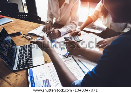 Business financial, accountant discussing with partner are meeting to audit finance planning sales to meet targets set in next year. stock market concept.