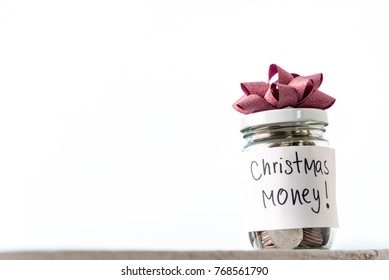 Business Financial Concept, Coins In Glass Jar With The Word Christmas Money Saving White Background