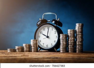 business financial ideas concept with coins stack and alarmclock isolate background with free copyspace for your creativity ideas text - Shutterstock ID 706427383