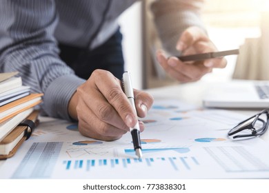Business Financing Accounting Banking Concept, businessman using smart phone and doing finances, calculate about cost to real estate investment and in other, tax system.