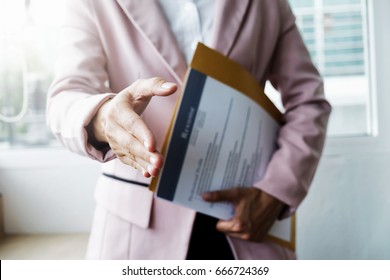 Business find new job, interview the job and hiring. Job applicant holding resume.Open handshake and resume job interview or acceptance. 
