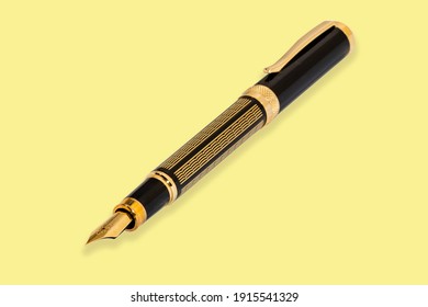 Business fountain pen isolated on yellow background