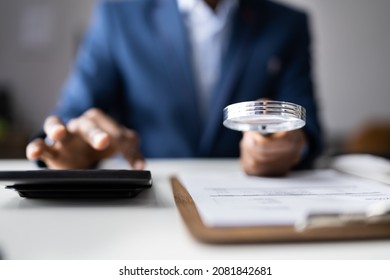 Business Fraud Investigation. Auditor Using Magnifying Glass To Investigate - Shutterstock ID 2081842681