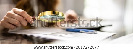 Business Fraud Investigation Using Magnifying Glass. Finance And Tax