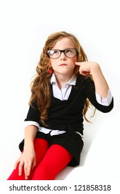 Business girl with glasses sitting and thinking