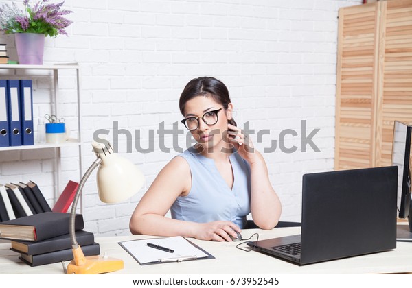 Business Girl Sits White Office Works Stock Photo Edit Now 673952545