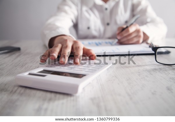 Business Girl Using Calculator His Desk Stock Photo Edit Now