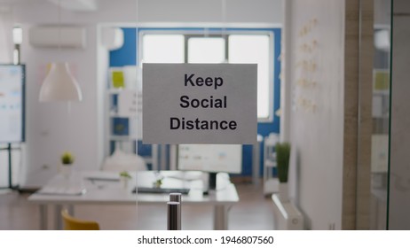 Business Glass Interior Office With Keep Social Distance Sign On The Wall. Modern Office Space With Nobody In It During Global Pandemic, Coronavirus Crisis