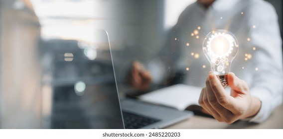 Business global internet connection application technology and digital marketing. Man hand holding Light bulb Global Internet connection. Financial and banking, Digital link tech, big data. - Powered by Shutterstock