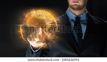 business, globalization and future technology concept - close up of businessman with earth hologram over black