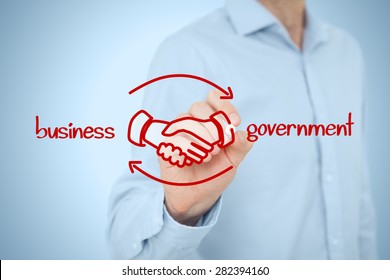 Business to government (B2G) concept - business model. Businessman (lobbyist) draw scheme with handshake partnership agreement. 