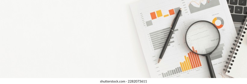 Business graphs, charts, magnifying glass and calculator on table. Financial development, Banking Account, Statistics - Powered by Shutterstock