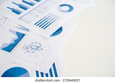 Business Graphs And Charts Report On Desk Of Financial Advisor. Financial Abstract Concepts.